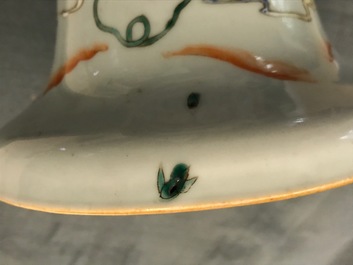 A Chinese famille rose vase with circular court scene design, 19th C.