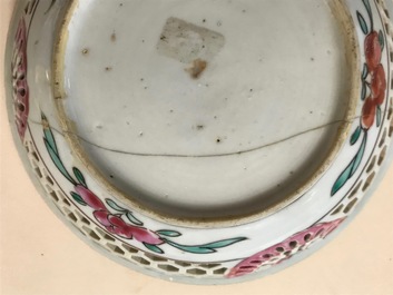 A reticulated double-walled Chinese famille rose cup and saucer, Yongzheng