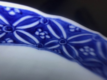 A Chinese blue and white moulded bowl with immortals, Chenghua mark, Kangxi