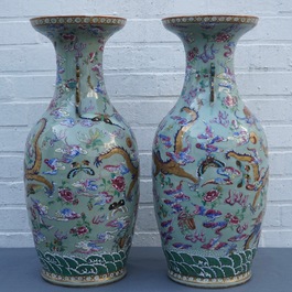 A pair of Chinese famille rose celadon-ground dragon vases, 19th C.