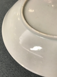 A Chinese cup and saucer with two figures in a landscape, Yongzheng