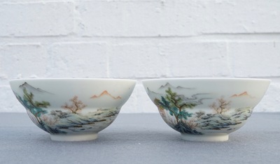 A pair of Chinese famille rose tea bowls with a landscape, Qianlong mark, 20th C.