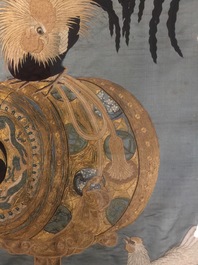 A Japanese silk embroidery depicting a rooster on an o-daiko drum, Edo or Meiji, 19th C.
