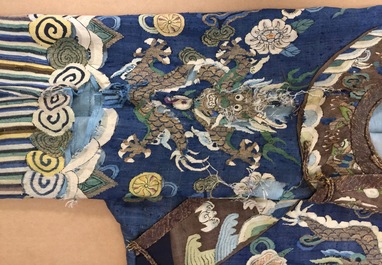 A Chinese blue-ground kesi eight-dragon robe, 19th C.