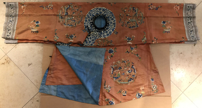 A Chinese orange-ground embroidered silk robe, 19th C.