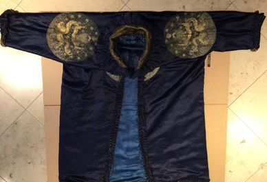 A blue-ground silk coat composed of Imperial Chinese gold thread dragon badges, 19th C.