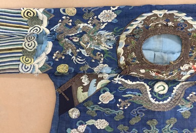 A Chinese blue-ground kesi eight-dragon robe, 19th C.