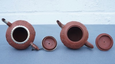 Two Chinese Yixing stoneware teapots with applied floral design, Kangxi