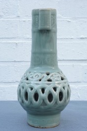 A Chinese celadon-glazed reticulated double-walled vase, 19/20th C.