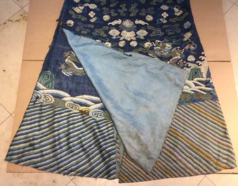 A Chinese blue-ground kesi eight-dragon robe, 19th C.