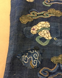 A Chinese blue-ground kesi eight-dragon robe, 19th C.