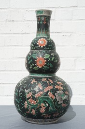 A Chinese black-ground famille verte double gourd dragon vase, 19th C.