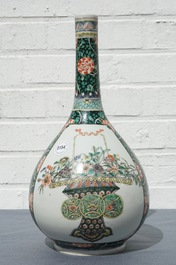 A Chinese famille verte bottle vase with fine flower baskets, 19th C.