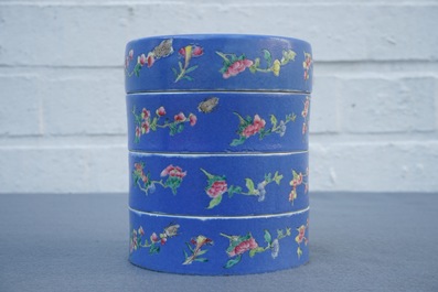 A Chinese blue-ground famille rose four-tier box, Tongzhi mark, 19th C.