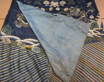 A Chinese blue-ground kesi eight-dragon robe, 19th C.