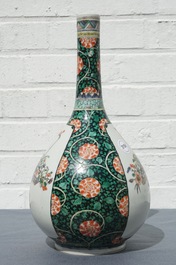 A Chinese famille verte bottle vase with fine flower baskets, 19th C.