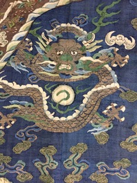 A Chinese blue-ground kesi eight-dragon robe, 19th C.