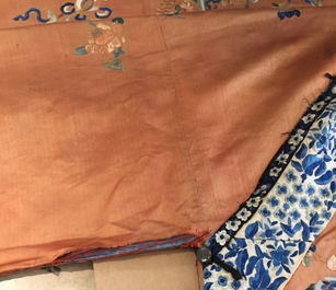 A Chinese orange-ground embroidered silk robe, 19th C.