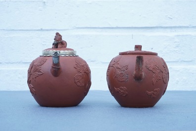 Two Chinese Yixing stoneware teapots with applied floral design, Kangxi