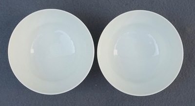A pair of Chinese famille rose tea bowls with a landscape, Qianlong mark, 20th C.
