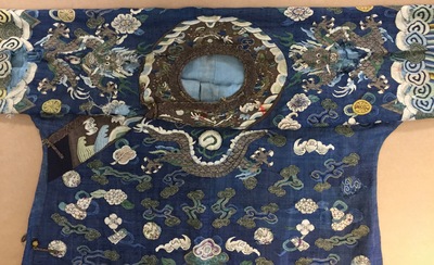 A Chinese blue-ground kesi eight-dragon robe, 19th C.