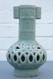 A Chinese celadon-glazed reticulated double-walled vase, 19/20th C.