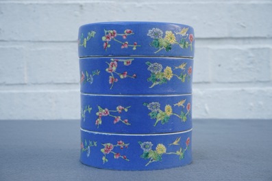 A Chinese blue-ground famille rose four-tier box, Tongzhi mark, 19th C.