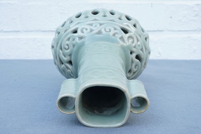 A Chinese celadon-glazed reticulated double-walled vase, 19/20th C.