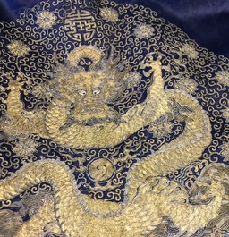 A blue-ground silk coat composed of Imperial Chinese gold thread dragon badges, 19th C.