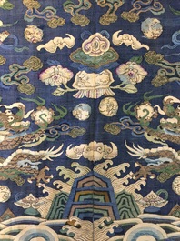 A Chinese blue-ground kesi eight-dragon robe, 19th C.