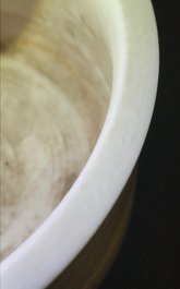 A Chinese cylindrical blanc de Chine Dehua censer on ruyi feet, 19/20th C.