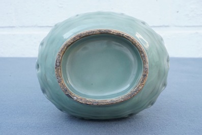 A Chinese celadon-glazed reticulated double-walled vase, 19/20th C.
