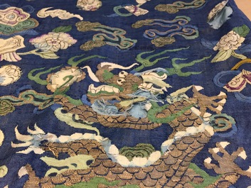 A Chinese blue-ground kesi eight-dragon robe, 19th C.