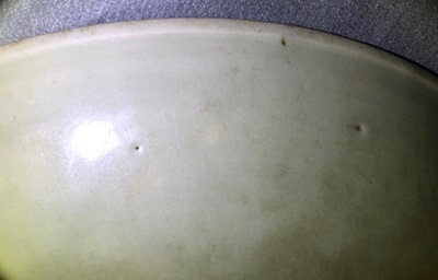 A massive Chinese Longquan celadon dish with underglaze design, Ming