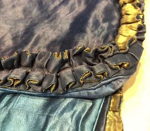 A blue-ground silk coat composed of Imperial Chinese gold thread dragon badges, 19th C.