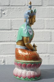 A Chinese parcel-gilt famille rose model of Buddha, 19th C.