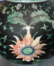 A Chinese black-ground famille verte double gourd dragon vase, 19th C.