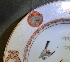 A pair of Chinese famille rose bianco sopra bianco plates, Yongzheng/Qianlong