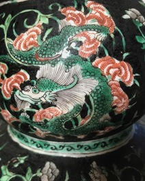 A Chinese black-ground famille verte double gourd dragon vase, 19th C.