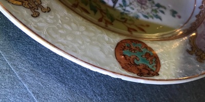 A pair of Chinese famille rose bianco sopra bianco plates, Yongzheng/Qianlong