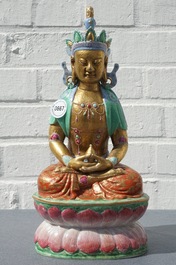 A Chinese parcel-gilt famille rose model of Buddha, 19th C.