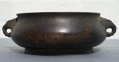 A Chinese bronze incense burner with elephant head handles, qianqing gongbao mark, Ming