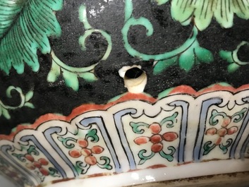 A Chinese black-ground famille verte double gourd dragon vase, 19th C.