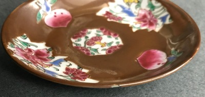 A Chinese famille rose capucin-ground teapot and six cups and saucers, Qianlong