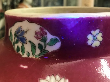 A pair of Chinese famille rose black-ground vases and covers, Yongzheng