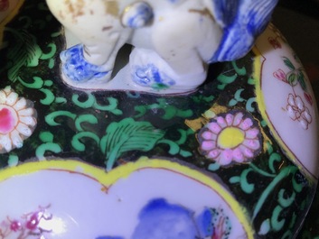 A pair of Chinese famille rose black-ground vases and covers, Yongzheng