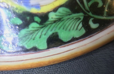 A pair of Chinese famille rose black-ground vases and covers, Yongzheng