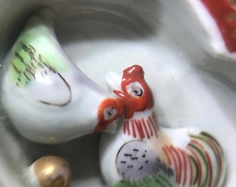 Two Japanese blue-ground Imari teapots with moulded designs of roosters and flowers, Edo, 17/18th C.