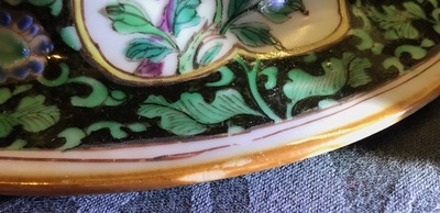 A pair of Chinese famille rose black-ground vases and covers, Yongzheng
