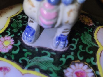 A pair of Chinese famille rose black-ground vases and covers, Yongzheng